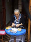 Woman making lace