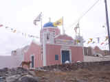 Our guide dog posing in front of the villiage chapel 