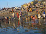 Washing their clothes and themselves in the holy Ganga River