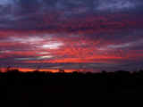 Sunset over the vast red sands