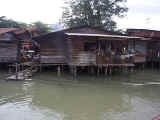 A shanty with the 'flags of the United Nations' waving in the breeze