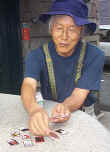 Johnny Hillwalker deals a hand of Japanese style plastic playing cards